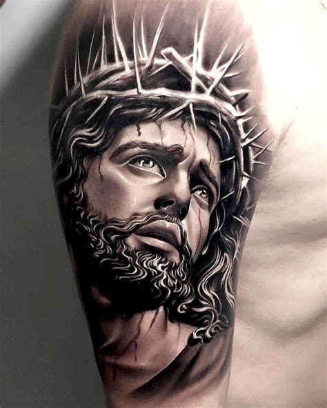 Cristo tattoo antebrazo